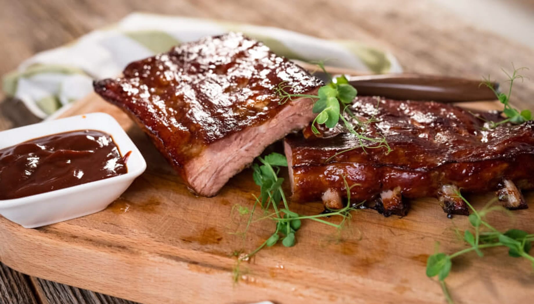 ribs Barbecue ribs on a wooden cutting board.
